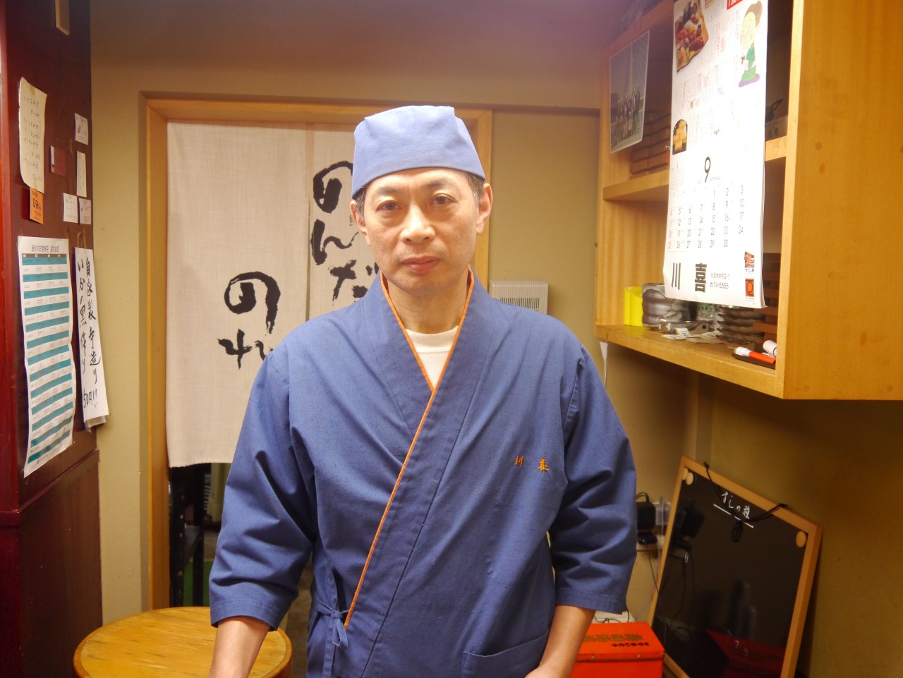 店主の余川さん。